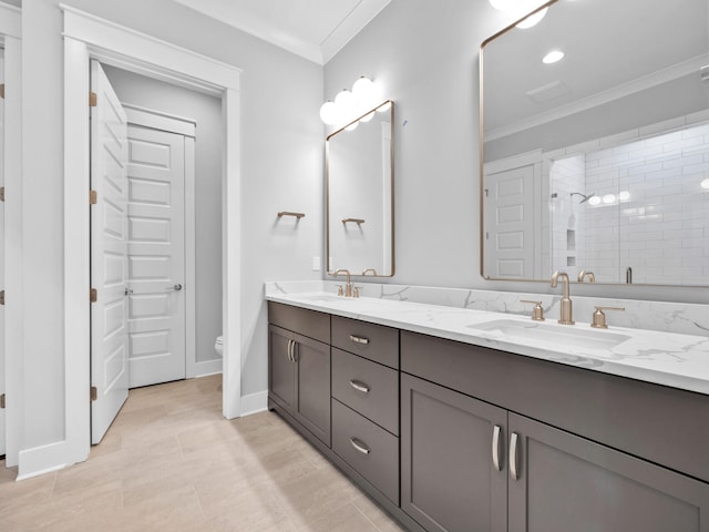 bathroom featuring tile patterned flooring, a shower with door, ornamental molding, vanity, and toilet