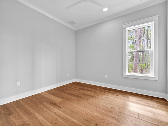 unfurnished room featuring ceiling fan, crown molding, and light hardwood / wood-style floors