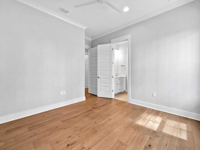 unfurnished bedroom with light hardwood / wood-style flooring, ensuite bath, ceiling fan, and ornamental molding