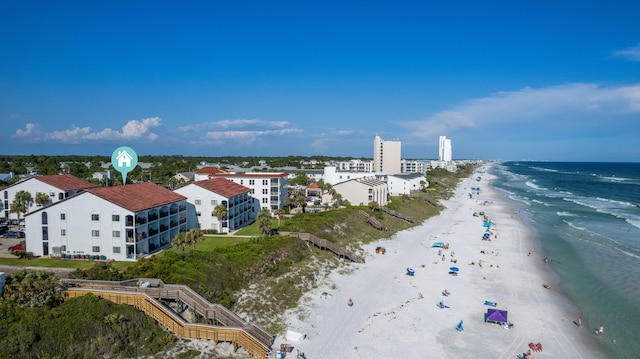 drone / aerial view featuring a view of the beach and a water view