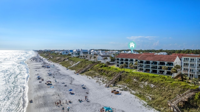 drone / aerial view with a water view and a view of the beach