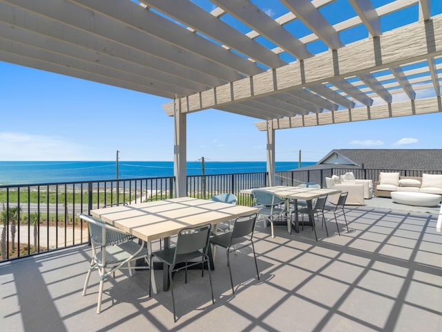 view of patio with a water view, outdoor lounge area, and a pergola