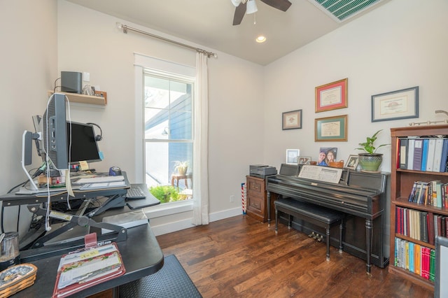 office space with dark wood-style floors, visible vents, plenty of natural light, and baseboards