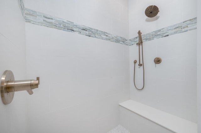 bathroom with a tile shower