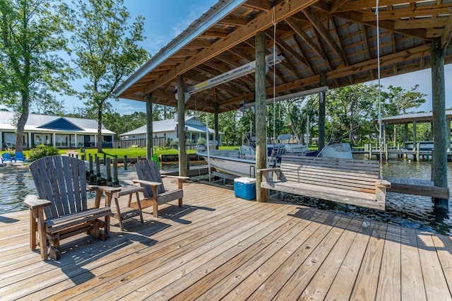 view of dock featuring a water view and boat lift