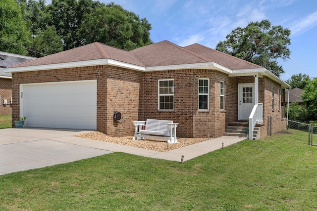 view of front facade with a garage and a front lawn