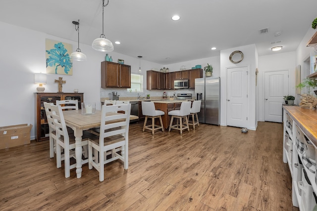 dining area with light hardwood / wood-style flooring