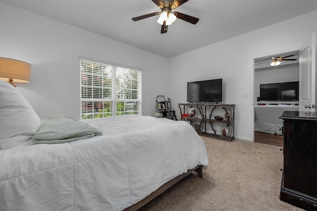 bedroom with light carpet and ceiling fan