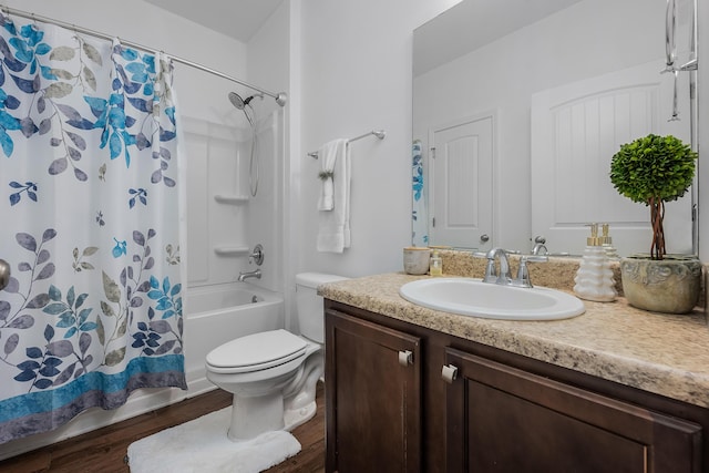 bathroom featuring vanity, hardwood / wood-style flooring, and toilet