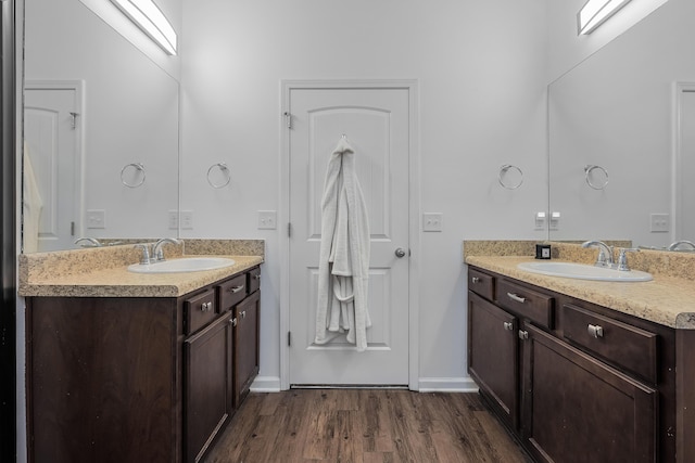 bathroom with vanity and hardwood / wood-style flooring