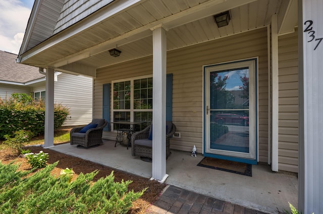 property entrance with covered porch