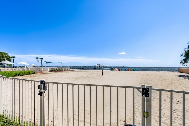 property view of water featuring fence