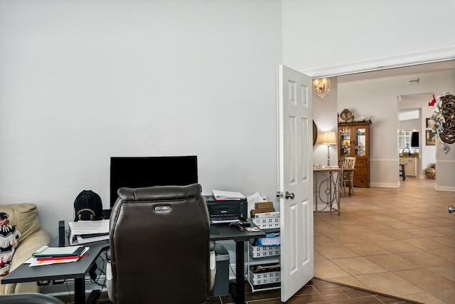 tiled office with an inviting chandelier