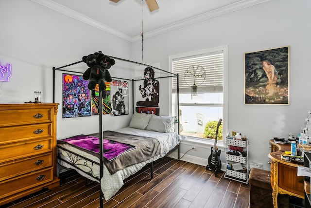 bedroom featuring ornamental molding, wood finished floors, a ceiling fan, and baseboards