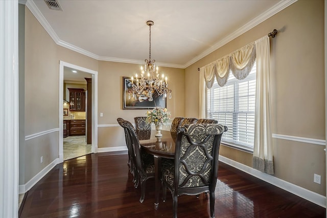 tiled dining area with a notable chandelier and ornamental molding