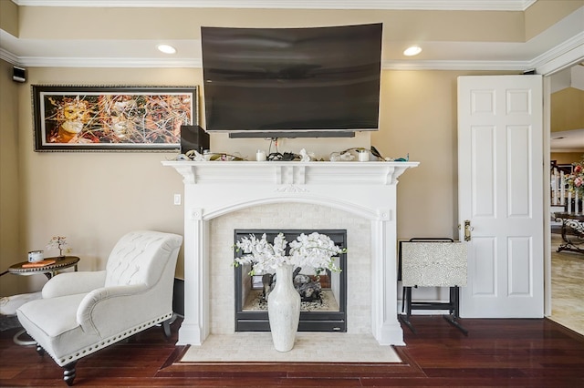 interior details featuring ornamental molding and hardwood / wood-style flooring