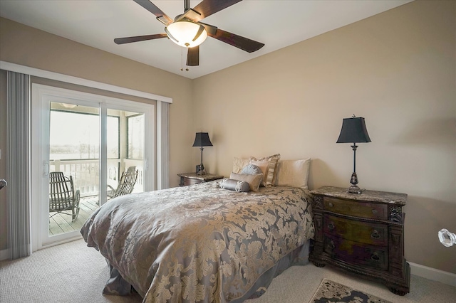 bedroom with ceiling fan, light carpet, and access to outside