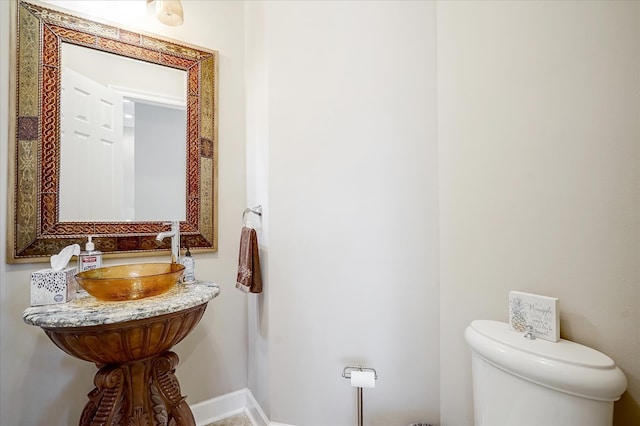 bathroom featuring sink and toilet