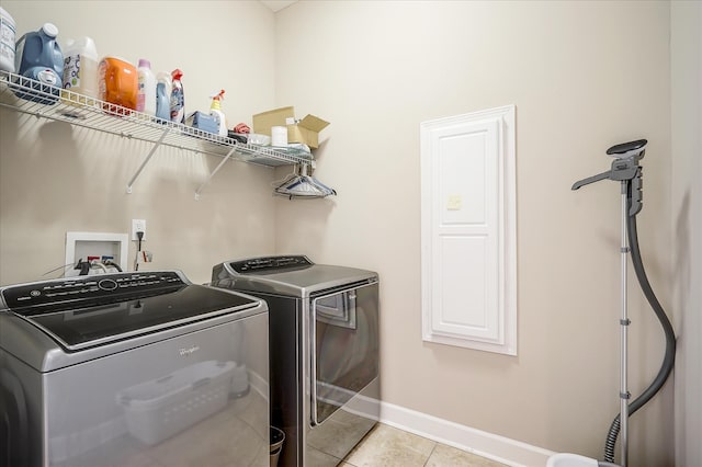 washroom with separate washer and dryer, washer hookup, and light tile floors