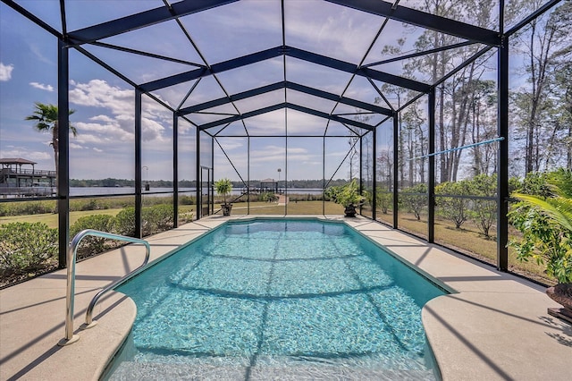 view of swimming pool featuring a lanai