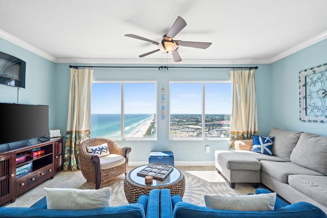 tiled living room with ceiling fan, a water view, and crown molding