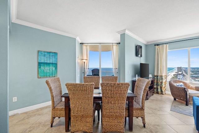 dining space featuring light tile patterned floors and ornamental molding