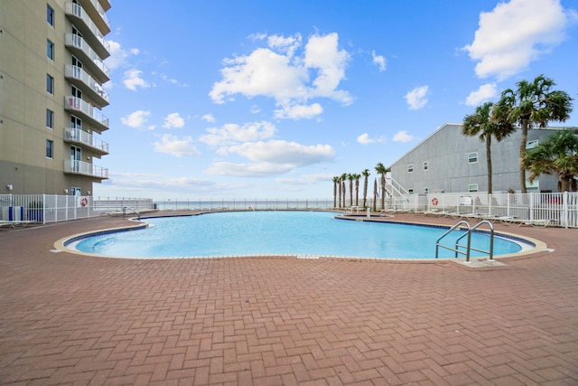 view of pool featuring a patio