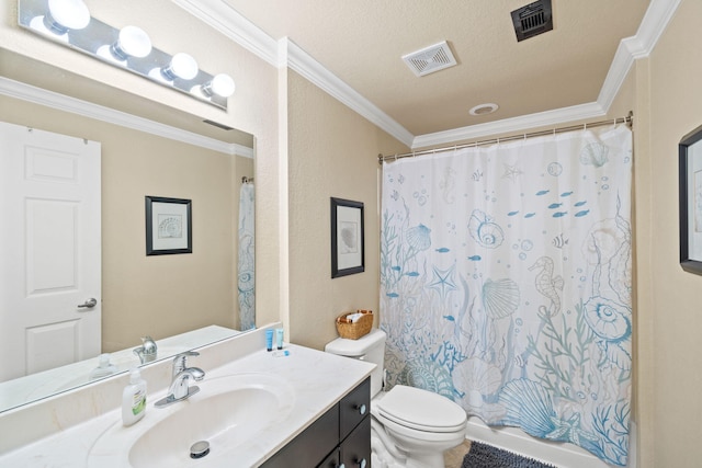 bathroom featuring vanity, toilet, ornamental molding, and a textured ceiling