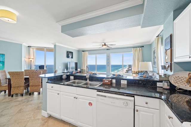 kitchen with ornamental molding, white dishwasher, ceiling fan, sink, and white cabinets