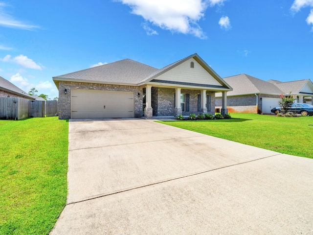 view of front of property featuring a garage and a front lawn