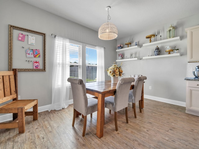 dining space with light wood-type flooring