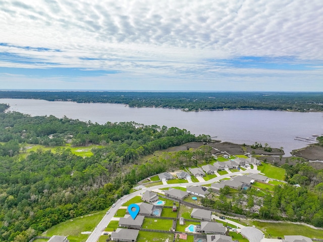 drone / aerial view featuring a water view and a residential view