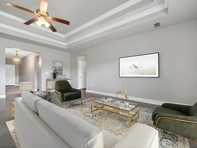 3527 Turquoise Dr, Navarre, FL 32566 - living area featuring a raised ceiling, baseboards, a ceiling fan, and visible vents