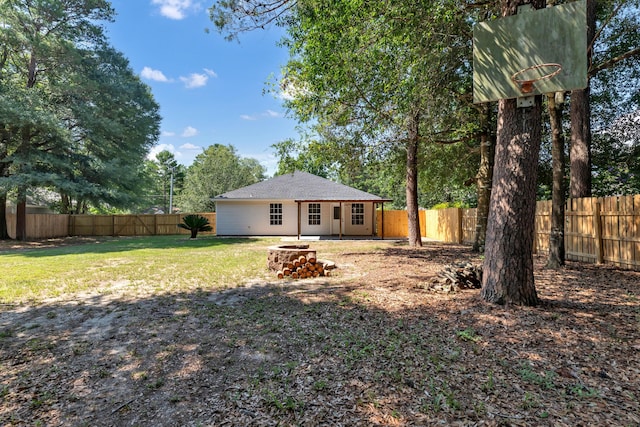 view of yard with an outdoor fire pit