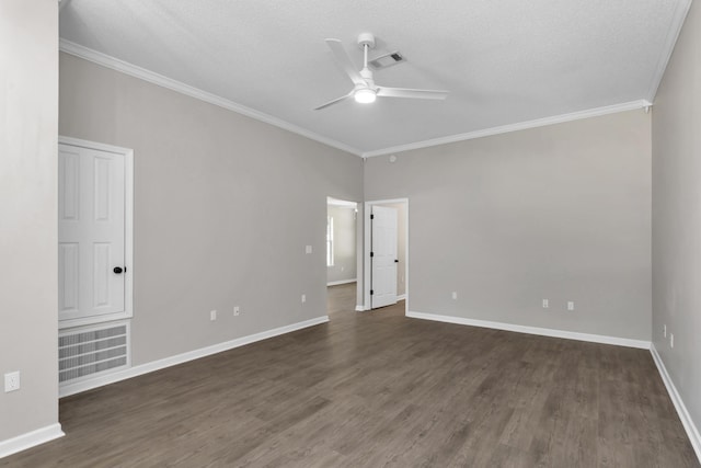 spare room featuring ceiling fan, dark hardwood / wood-style flooring, a textured ceiling, and crown molding