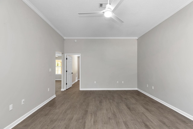 empty room with a textured ceiling, ceiling fan, dark hardwood / wood-style floors, and crown molding