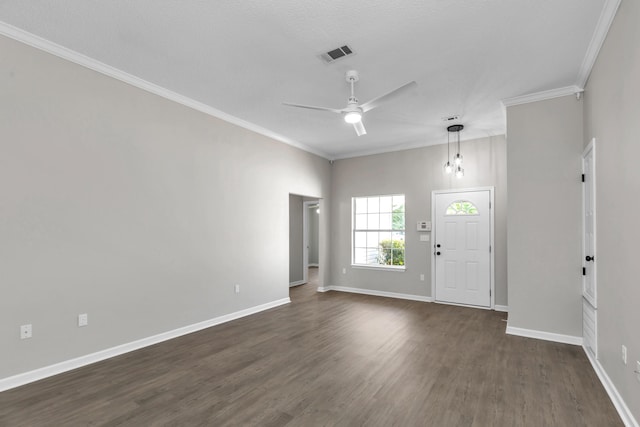 foyer with a textured ceiling, crown molding, ceiling fan, and dark wood-type flooring