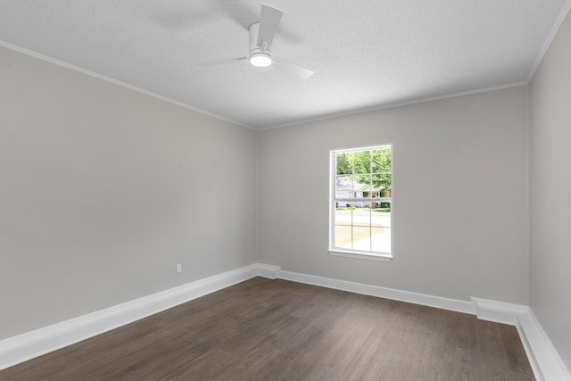 spare room featuring ceiling fan, dark hardwood / wood-style flooring, a textured ceiling, and ornamental molding