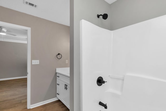 bathroom with vanity, hardwood / wood-style flooring, and ceiling fan