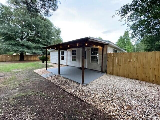 rear view of property with a patio area