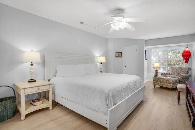 bedroom featuring light wood-type flooring and ceiling fan