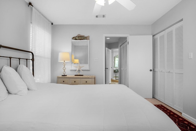 bedroom with ceiling fan and a closet