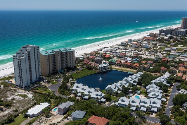 bird's eye view with a water view and a view of the beach