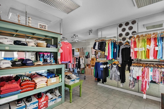 walk in closet featuring light tile patterned flooring