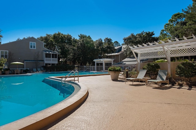 view of swimming pool with a pergola and a patio area