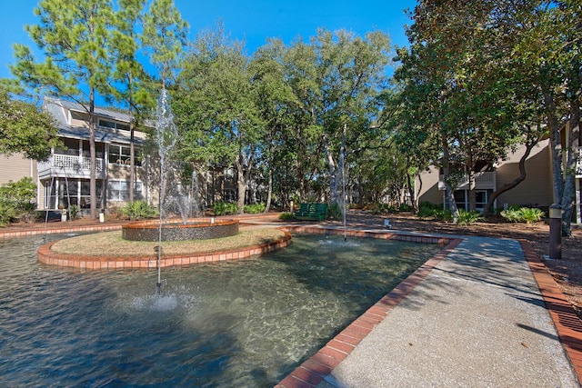 view of home's community featuring a water view