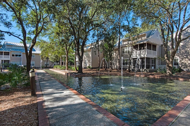 view of home's community with a water view