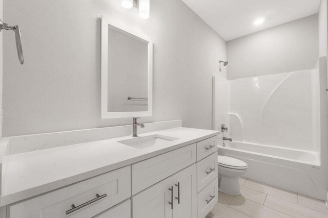 full bathroom featuring vanity, toilet, and shower / bathing tub combination