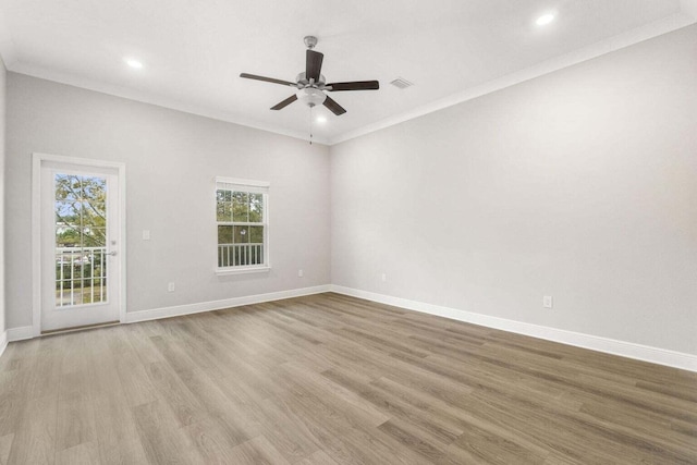 unfurnished room with ornamental molding, ceiling fan, and light hardwood / wood-style flooring