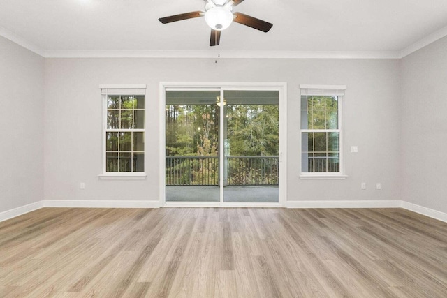 unfurnished room with crown molding, ceiling fan, and light hardwood / wood-style floors